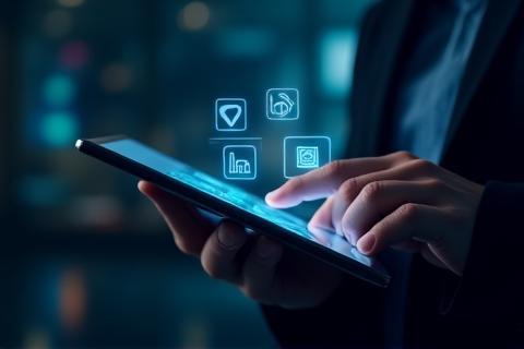 Person working on a tablet with various media icons.